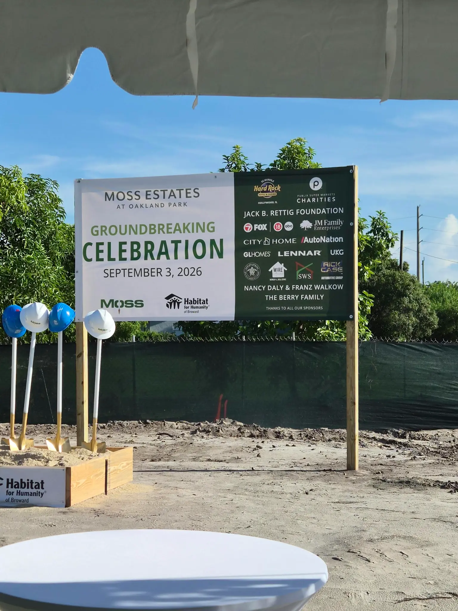 Moss Estates at Oakland Park groundbreaking sign and ceremonial shovels