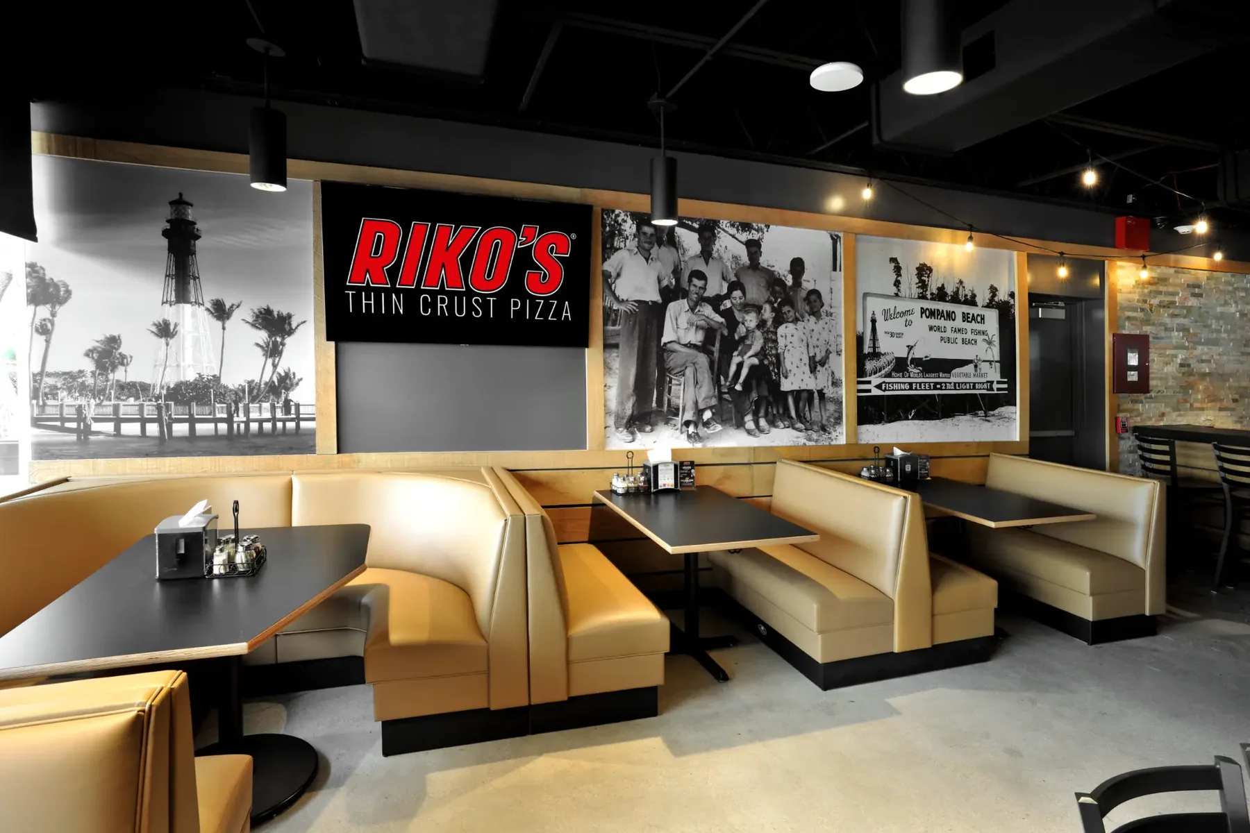 Riko’s Pizza dining room with historic Pompano Beach murals